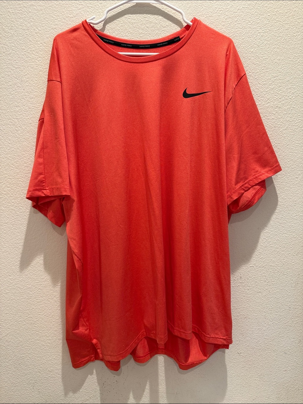 Nike Men’s Coral-Red Short Sleeve Athletic Tee with Black Swoosh
